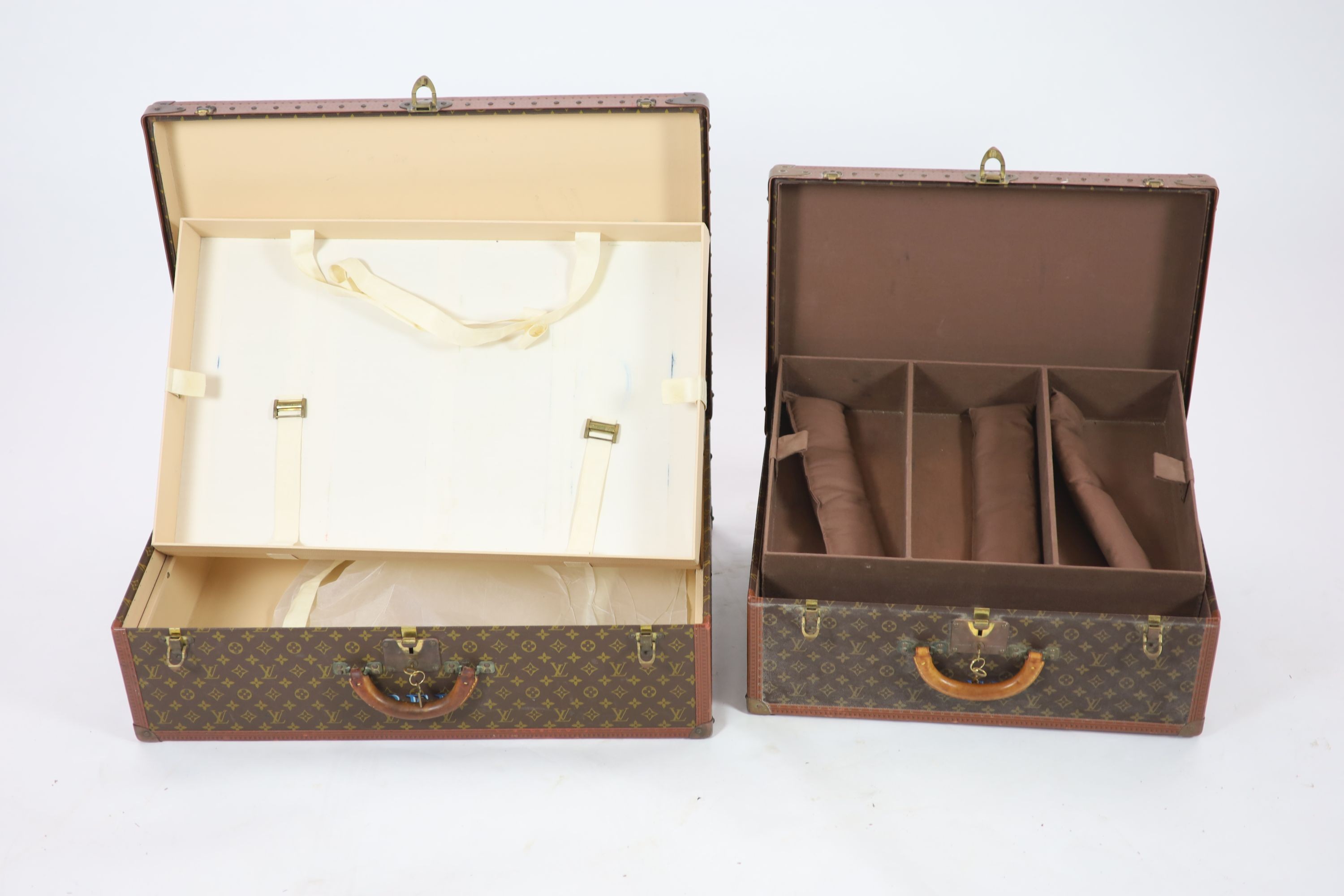 Two graduated Louis Vuitton Alzer suitcase trunks